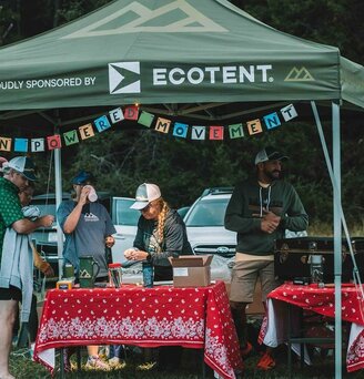 A canopy tent set up for race day check in.